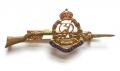 Military Police gilt and enamel rifle sweetheart brooch